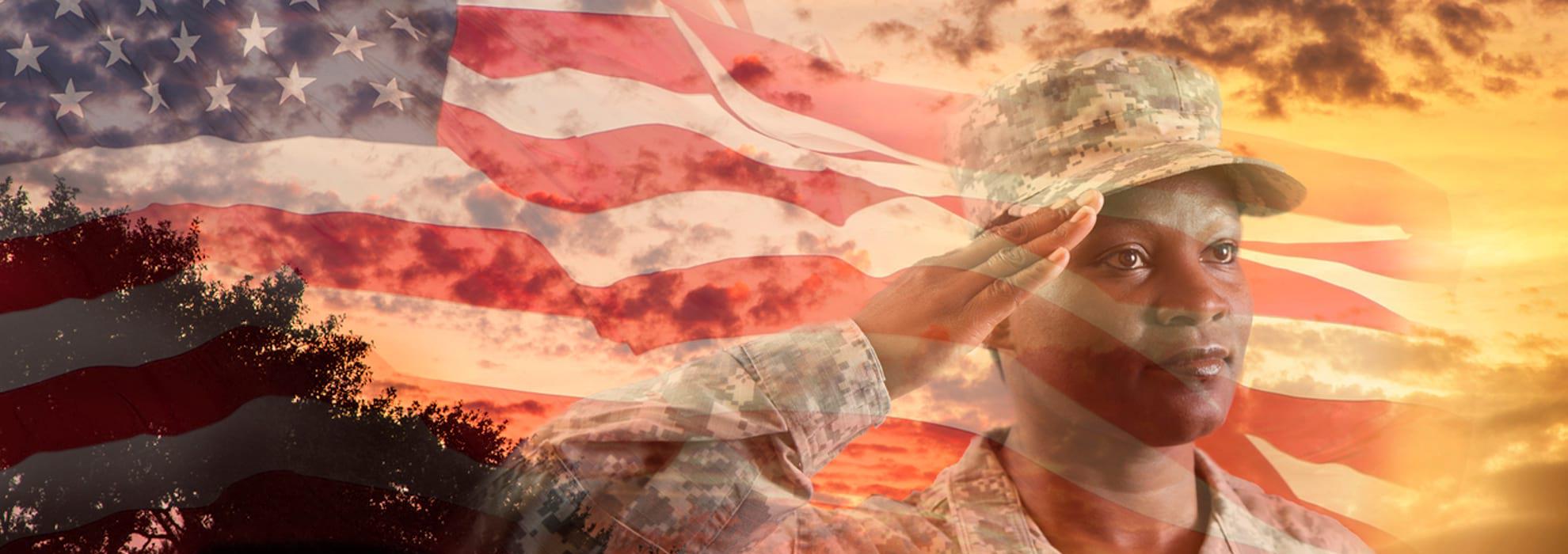 Person saluting with American and sky flag in background .