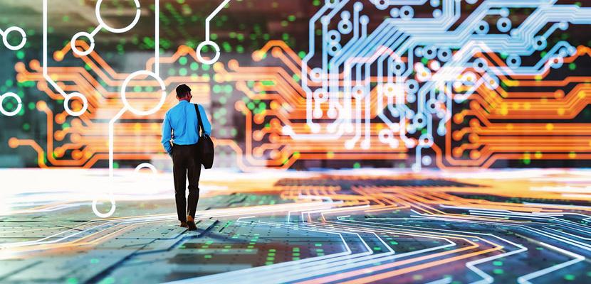 A man walking on and through computer circuitry.